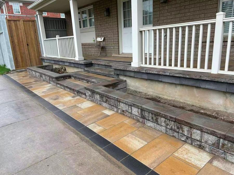 Front porch with a railing and flagstone steps