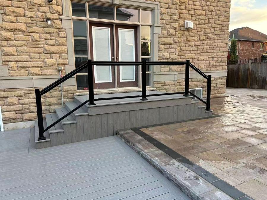 Rebuilt front-entrance stone steps with a railing
